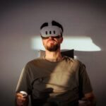 a man wearing a mask and holding a remote