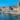 boats docked near seaside promenade]