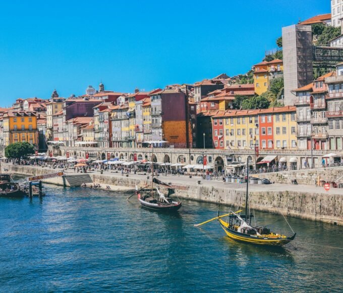 boats docked near seaside promenade]
