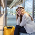 A picture of a woman waiting for the shuttle bus.