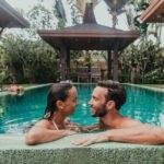 A couple sharing a loving moment in a resort.