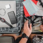 A traveler packing his bag without a smart tracker