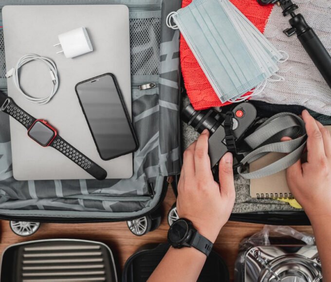 A traveler packing his bag without a smart tracker